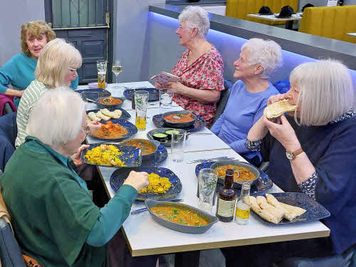 Six of our members tucking into a delicious Indian meal