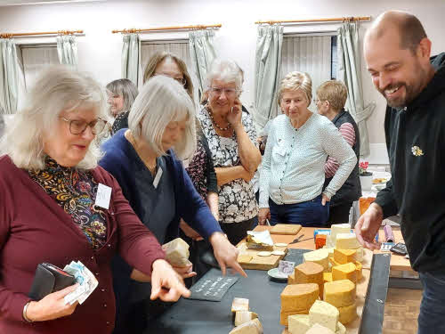 Members selecting cheese to buy from the Weird and Wonderful Cheese Company